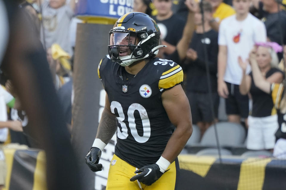Pittsburgh Steelers running back Jaylen Warren (30) celebrates after scoring a touch down in the first half of an NFL preseason football game against the Buffalo Bills, in Pittsburgh, Saturday, Aug. 19, 2023. (AP Photo/Gene Puskar)