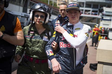 Formula One - Monaco Grand Prix - Monaco - 28/5/16. Red Bull Racing F1 driver Max Verstappen is escorted by a doctor after his crash during the qualifying session. REUTERS/Andrej Isakovic/POOL