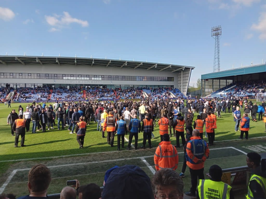 Oldham fans invaded the pitch to protest during the match against Salford (Lee Morris/PA) (PA Media)