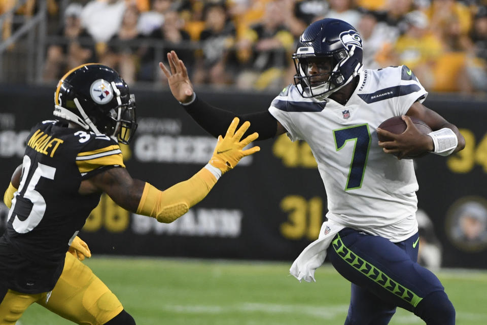 Seattle Seahawks quarterback <a class="link " href="https://sports.yahoo.com/nfl/players/26662" data-i13n="sec:content-canvas;subsec:anchor_text;elm:context_link" data-ylk="slk:Geno Smith;sec:content-canvas;subsec:anchor_text;elm:context_link;itc:0">Geno Smith</a> (7) tries to break away from Pittsburgh Steelers cornerback <a class="link " href="https://sports.yahoo.com/nfl/players/30415" data-i13n="sec:content-canvas;subsec:anchor_text;elm:context_link" data-ylk="slk:Arthur Maulet;sec:content-canvas;subsec:anchor_text;elm:context_link;itc:0">Arthur Maulet</a> (35) on a long scramble during the first half of an NFL preseason football game, Saturday, Aug. 13, 2022, in Pittsburgh. (AP Photo/Barry Reeger)