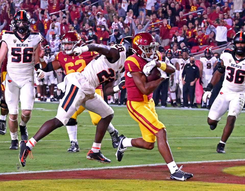 Sep 25, 2021; Los Angeles, California, USA; USC Trojans wide receiver Gary Bryant Jr. (1) gets past Oregon State Beavers defensive back Kitan Oladapo (28) an runs into the end zone for a touchdown in the first half of the game at United Airlines Field at Los Angeles Memorial Coliseum. Jayne Kamin-Oncea-USA TODAY Sports