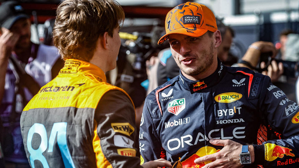 Oscar Piastri speaks with Max Verstappen.