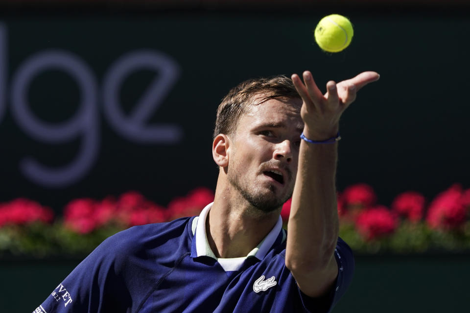 Daniil Medvedev, of Russia, serves to Gael Monfils, of France, at the BNP Paribas Open tennis tournament Monday, March 14, 2022, in Indian Wells, Calif. (AP Photo/Marcio Jose Sanchez)