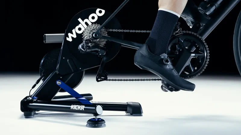  A close up of the Wahoo Kickr V6 while a rider pedals a bike 