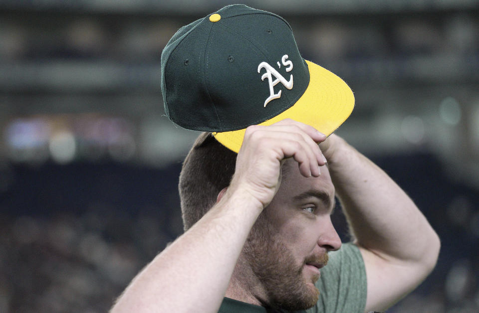 Oakland Athletics pitcher Liam Hendriks listens to a question from a journalist prior to a pre-season exhibition baseball game between the Athletics and the Nippon Ham Fighters at Tokyo Dome in Tokyo Monday, March 18, 2019. Hendriks made the jump from playing tee-ball in Australia to being the opening pitcher last season for the Athletics in the playoffs. (AP Photo/Eugene Hoshiko)