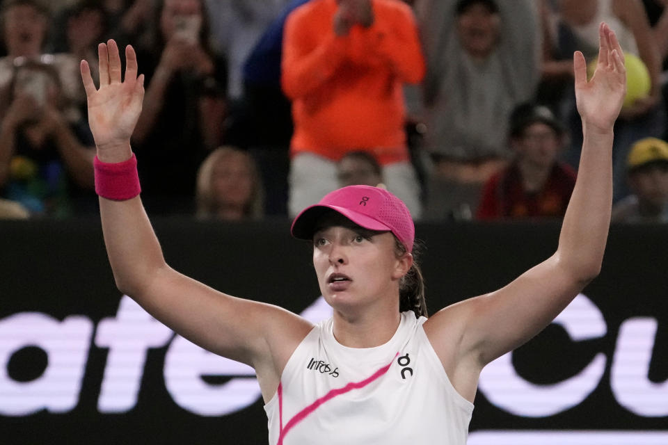 Iga Swiatek of Poland celebrates after defeating Danielle Collins of the U.S. in their second round match at the Australian Open tennis championships at Melbourne Park, Melbourne, Australia, Thursday, Jan. 18, 2024. (AP Photo/Andy Wong)