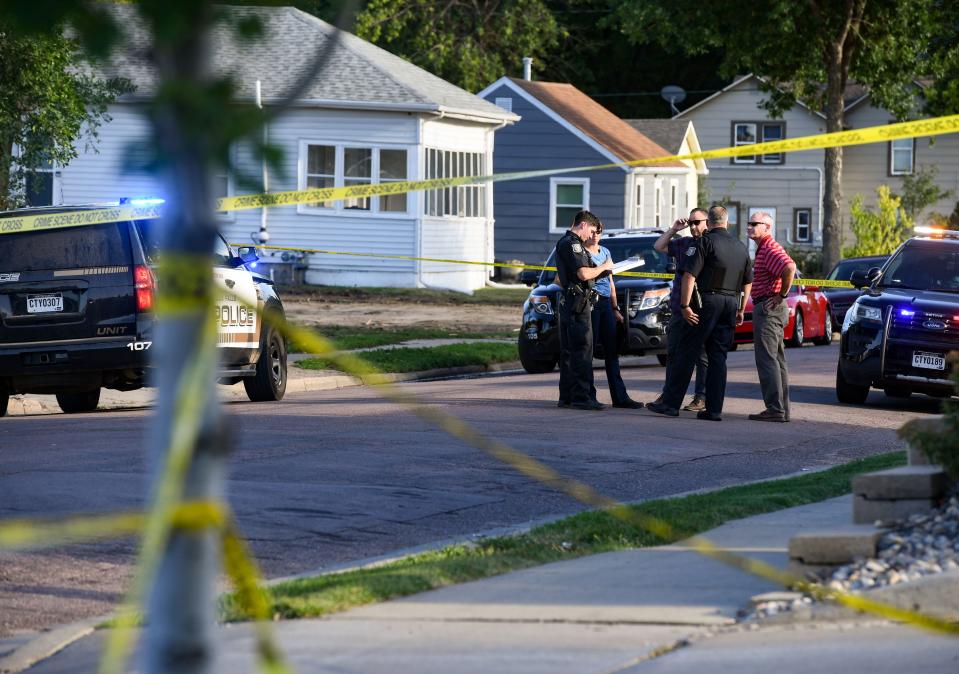 A crime scene is established after shots fired at the Burger King on 12th Street on Tuesday, August 9, 2022, in Sioux Falls.