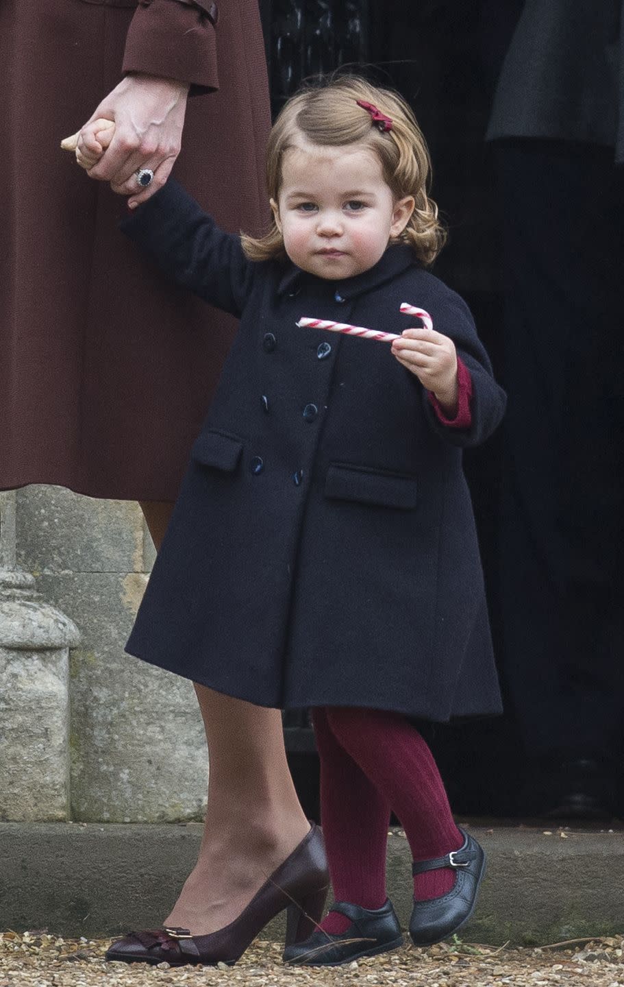 <p>While spending the holidays with Kate Middleton's family in Berkshire, Princess Charlotte shows off the candy cane she received at their Christmas church service.</p>