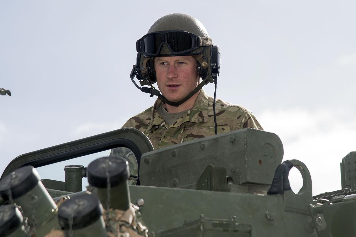 Britain's Prince Harry sits in a New Zealand Army light armoured vehicle (LAV) during a visit to Linton Military Camp in Linton, near Palmerston North, on May 13, 2015. Prince Harry arrived in New Zealand on May 9 for a week-long visit.    AFP PHOTO / MARTY MELVILLE        (Photo credit should read Marty Melville/AFP via Getty Images)