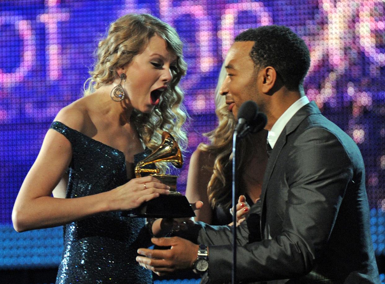 John Legend presents to Taylor Swift the award for the Best Album of the Year during the 52nd annual Grammy Awards in Los Angeles, California on January 31, 2010