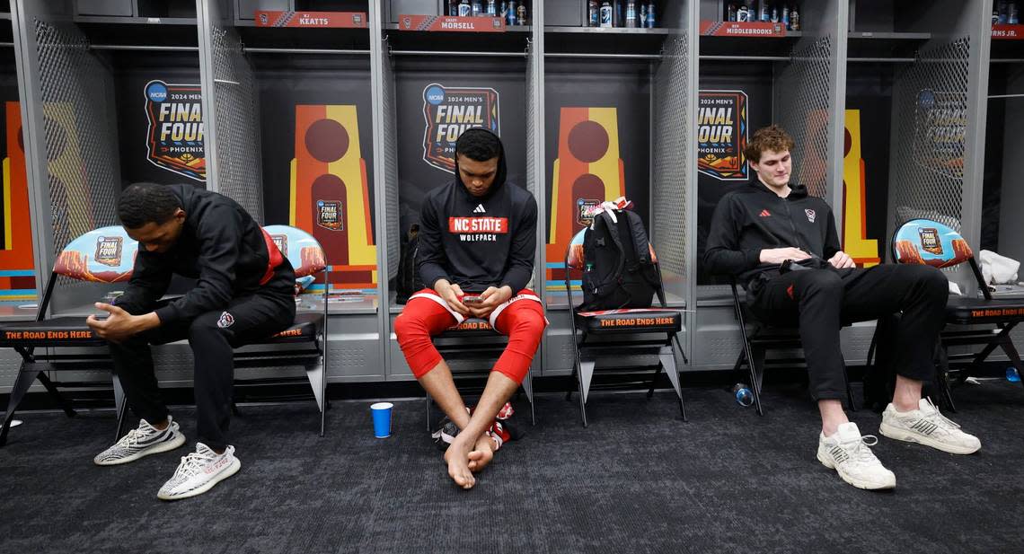 N.C. State’s KJ Keatts, left, Casey Morsell and Ben Middlebrooks sit in the locker room after Purdue’s 63-50 victory over N.C. State in the NCAA Tournament national semifinals at State Farm Stadium in Glendale, Ariz., Saturday, April 6, 2024. Ethan Hyman/ehyman@newsobserver.com