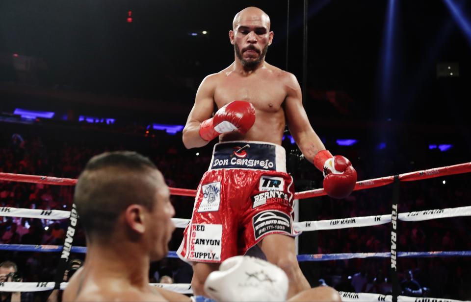 Ray Beltran, above, knocks down Jonathan Maicelo during the second round of a lightweight championship on May 20, 2017, in New York. (AP Photo/Frank Franklin II)