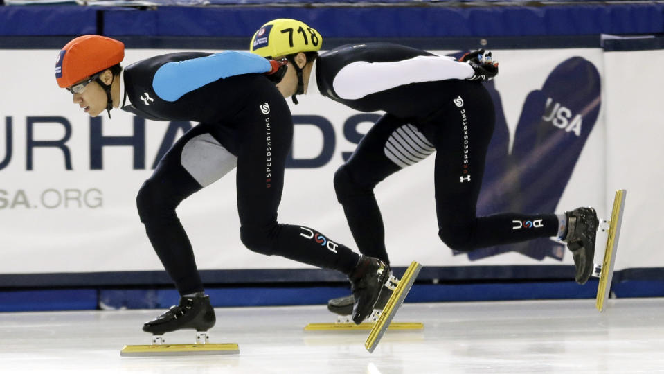 J.R. Celski, left, and Kyle Carr, right, compete in the men's 1,500 meters during the U.S. Olympic short track trials, Friday, Jan. 3, 2014, in Kearns, Utah. (AP Photo/Rick Bowmer)