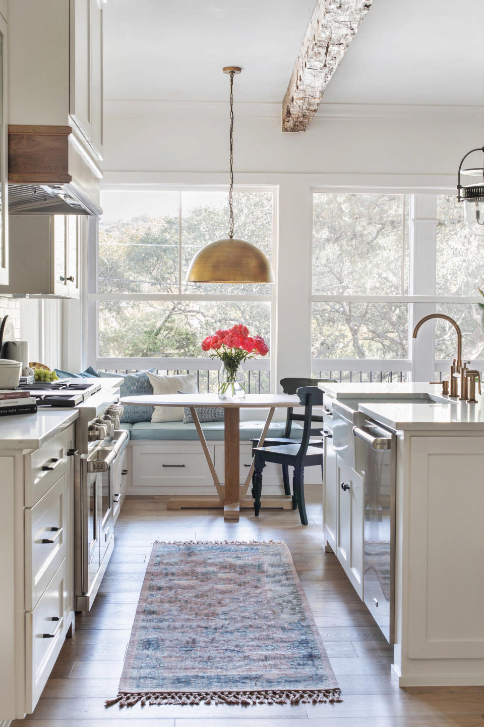 A kitchen with a rug