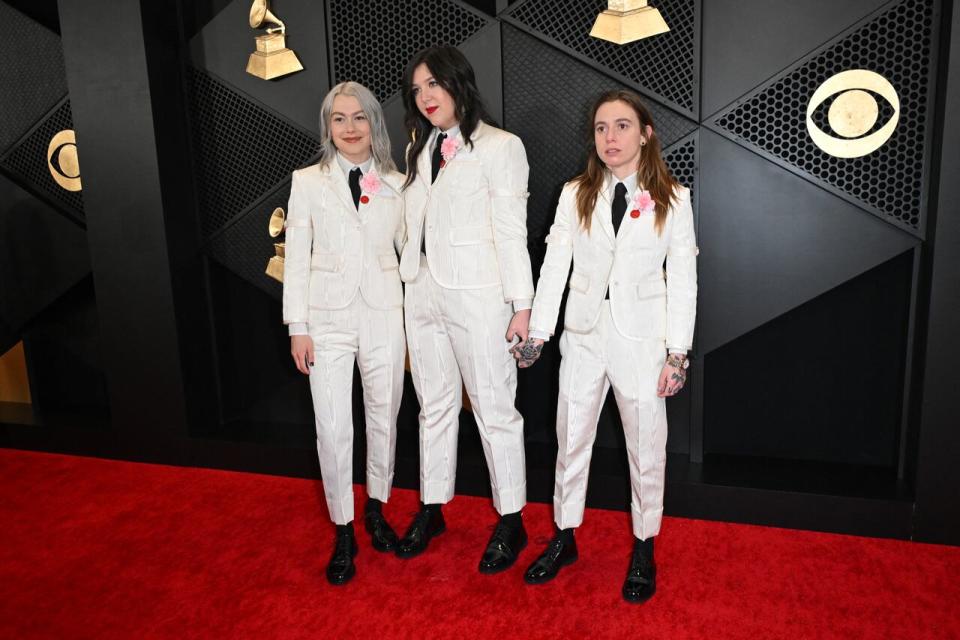 From left, Phoebe Bridgers, Lucy Dacus and Julien Baker of American rock group boygenius arrive on the Grammys red carpet after winning best alternative music album during the ceremony pre-show.