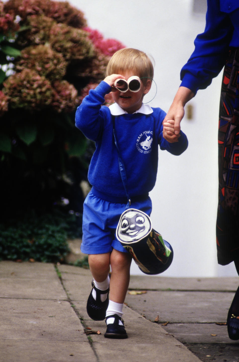 LONDON - SEPTEMBER 16:  Prince Harry looks at  photographers as he leaves on his first day at Mrs. Mynor's nursery school on September 16, 1987 in Notting Hill, London. (Photo by David Levenson/Getty Images)