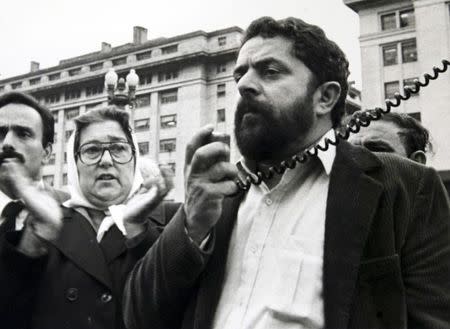 Luiz Inacio Lula da Silva (R), then Brazilian union leader, speaks in support of Argentine human rights activist Hebe de Bonafini (C) and the Mothers of the Plaza de Mayo during a visit to Buenos Aires in this 1985 file photo. REUTERS/Noticias Argentinas