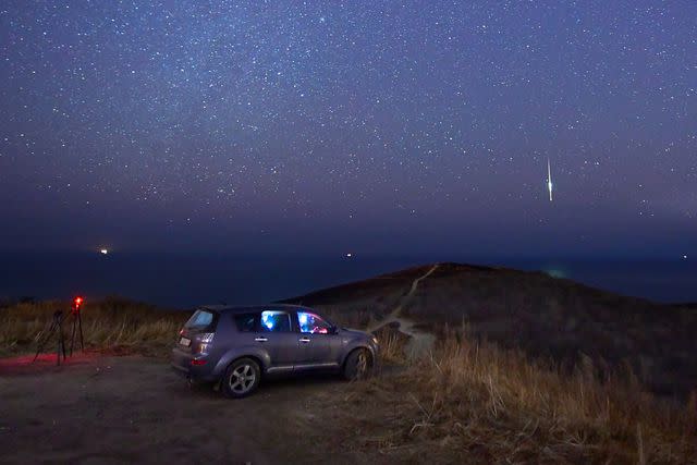 Yuri SmityukTASS via Getty Images Geminid meteor shower in Vladivostok, Russia