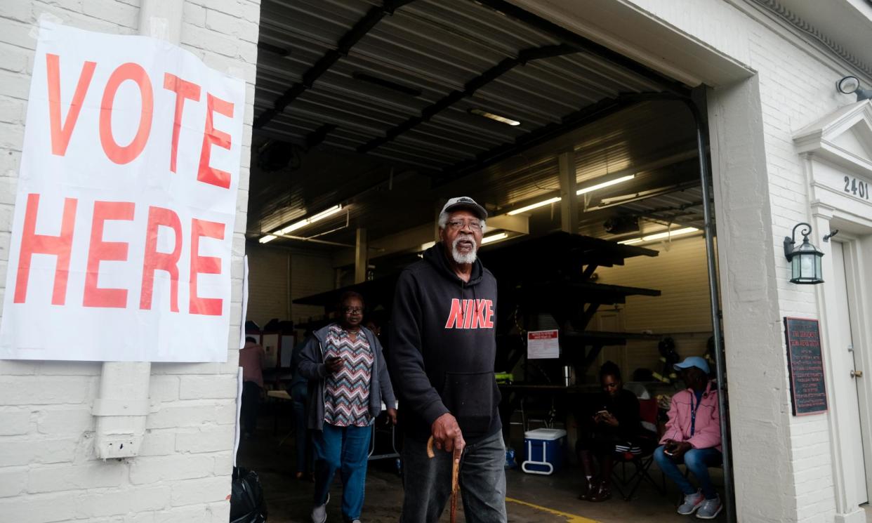 <span>A voter is seen exiting a polling station at the Selma fire station on Super Tuesday in Selma, Alabama.</span><span>Photograph: Michael McCoy/Reuters</span>