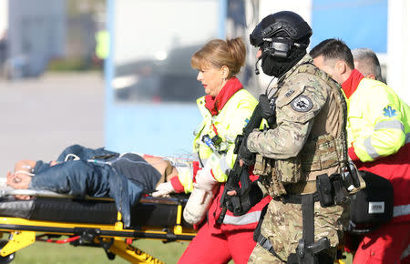 Participants of the European Union Force (EUFOR), Armed Forces, Border Police and State Investigation and Protection Agency (SIPA) of Bosnia and Herzegovina practice an anti-terrorism situation during an exercise at the Sarajevo International Airport, Bosnia and Herzegovina October 13, 2017. REUTERS/Dado Ruvic