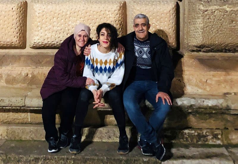 Ghada Zitouni, Isam Alkousaa pose for a picture at Alhambra Palace