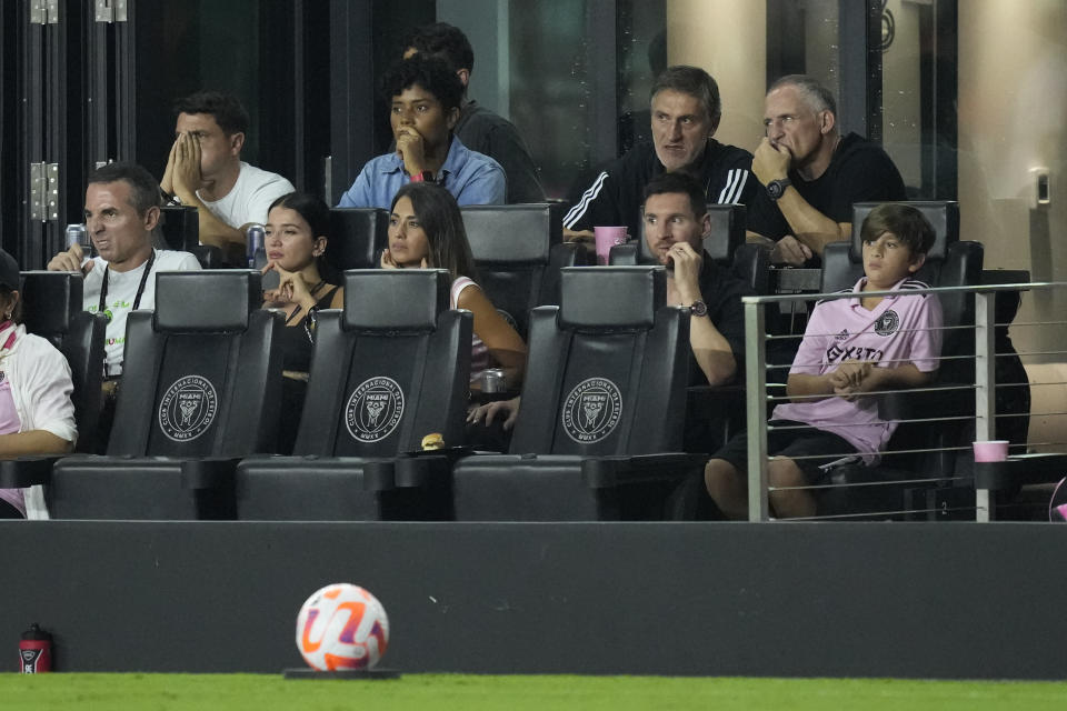 Inter Miami forward Lionel Messi, center right, the second half of the U.S. Open Cup final soccer match against the Houston Dynamo watches with his family from a suite Wednesday, Sept. 27, 2023, in Fort Lauderdale, Fla. (AP Photo/Rebecca Blackwell)