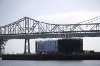 A barge built with four levels of shipping containers is seen at Pier 1 at Treasure Island in San Francisco, California October 28, 2013. How badly does Google want to keep under wraps a mysterious project taking shape on a barge in San Francisco Bay? Badly enough to require U.S. government officials to sign confidentiality agreements. REUTERS/Stephen Lam (UNITED STATES - Tags: SCIENCE TECHNOLOGY BUSINESS)