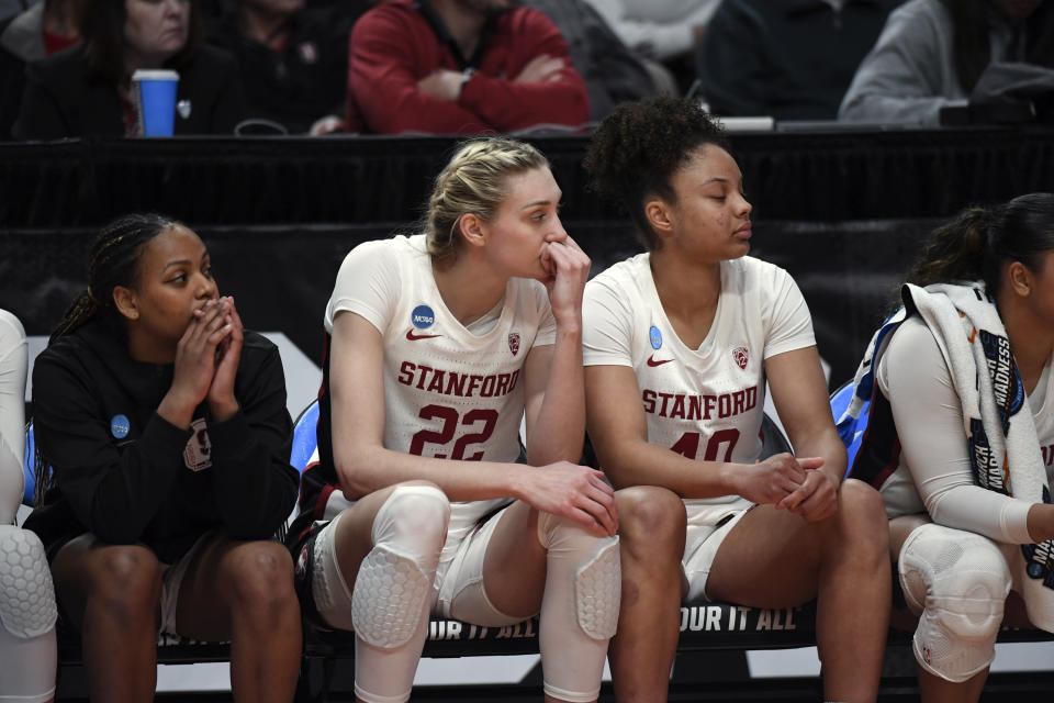 Stanford forward Cameron Brink (22) watches from the bench after fouling out during the second half of a Sweet 16 college basketball game in the NCAA Tournament against North Carolina State, Friday, March 29, 2024, in Portland, Ore. North Carolina State won 77-67. (AP Photo/Steve Dykes)