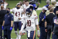 FILE - Chicago Bears quarterback Mitchell Trubisky (10) walks off the field after an NFL wild-card playoff football game against the New Orleans Saints in New Orleans, in this Sunday, Jan. 10, 2021, file photo. The Saints now 21-9. One after another, quarterbacks once believed to be franchise cornerstones after being top five picks changed addresses this offseason in staggering success. Trubisky had to settle for a backup contract deal after flaming out in Chicago. (AP Photo/Brett Duke, File)
