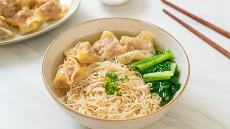 Wontons, noodles, and bok choy soup