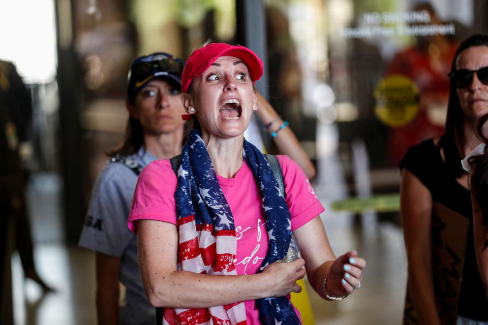 People protest against the school mask mandate, enacted to help slow the spread of coronavirus disease (COVID-19), outside a Hillsborough County School Board meeting in Tampa, Florida, U.S. May 18, 2021.  REUTERS/Octavio Jones