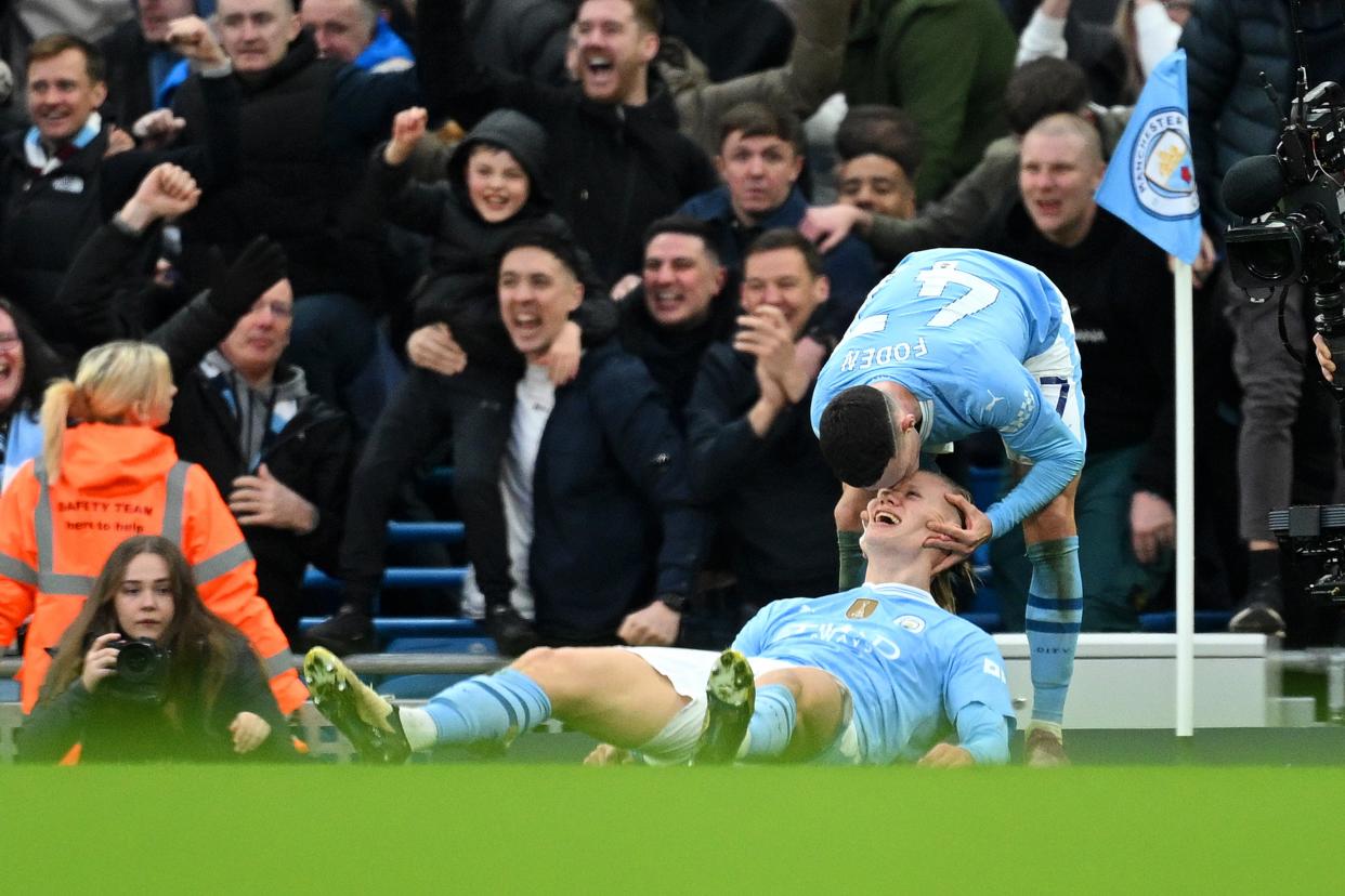 Erling Haaland celebrates with Phil Foden. (Michael Regan/Getty Images)