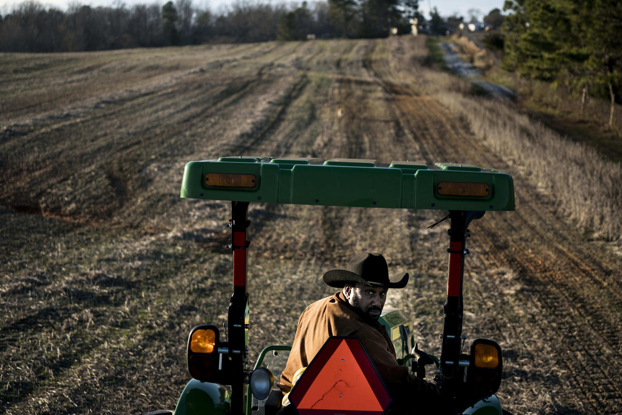 John Boyd plants winter wheat in one of his fields in Baskerville, Va. (Melina Mara / The Washington Post via Getty Images file)