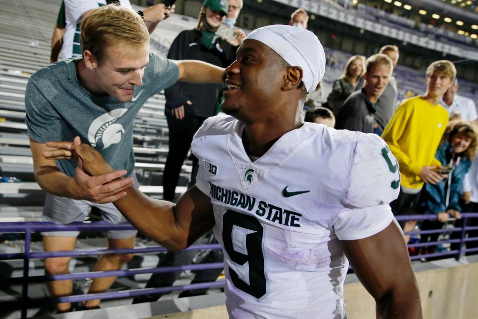 Michigan State Spartans running back Kenneth Walker III celebrates their victory with fans after the game at Ryan Field. The Michigan State Spartans won 38-21 on Friday, Sept. 3, 2021.