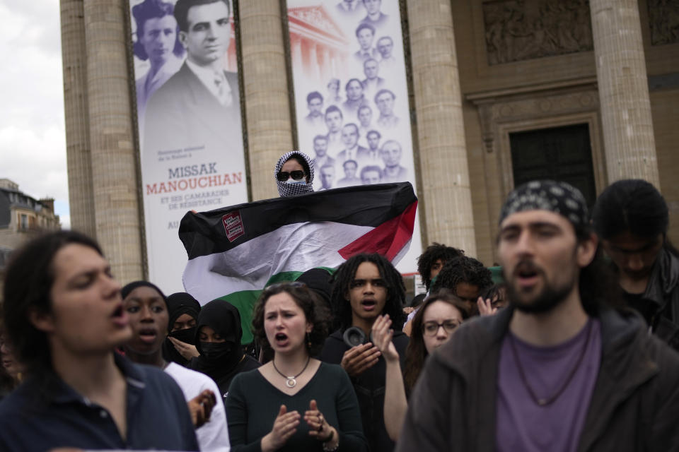 Students demonstrate outside the Pantheon monument Friday, May 3, 2024 in Paris. Students waved Palestinian flags and chanted slogans in support of residents of Gaza, as Israel continues its offensive following the deadly Oct. 7 Hamas-led attack that triggered the Israeli-Hamas war. (AP Photo/Christophe Ena)