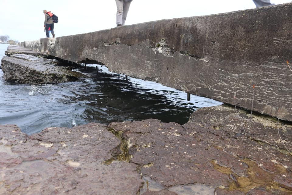 Holes and deterioration in the east breakwater in Great Sodus Bay where decades of wave action, ice, and storms from Lake Ontario have deteriorated the structure in Sodus Point on April 26, 2023.