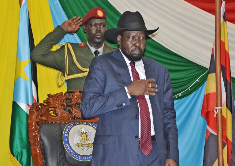 South Sudan's President Salva Kiir (C) before signing peace agreement in Juba on August 26, 2015