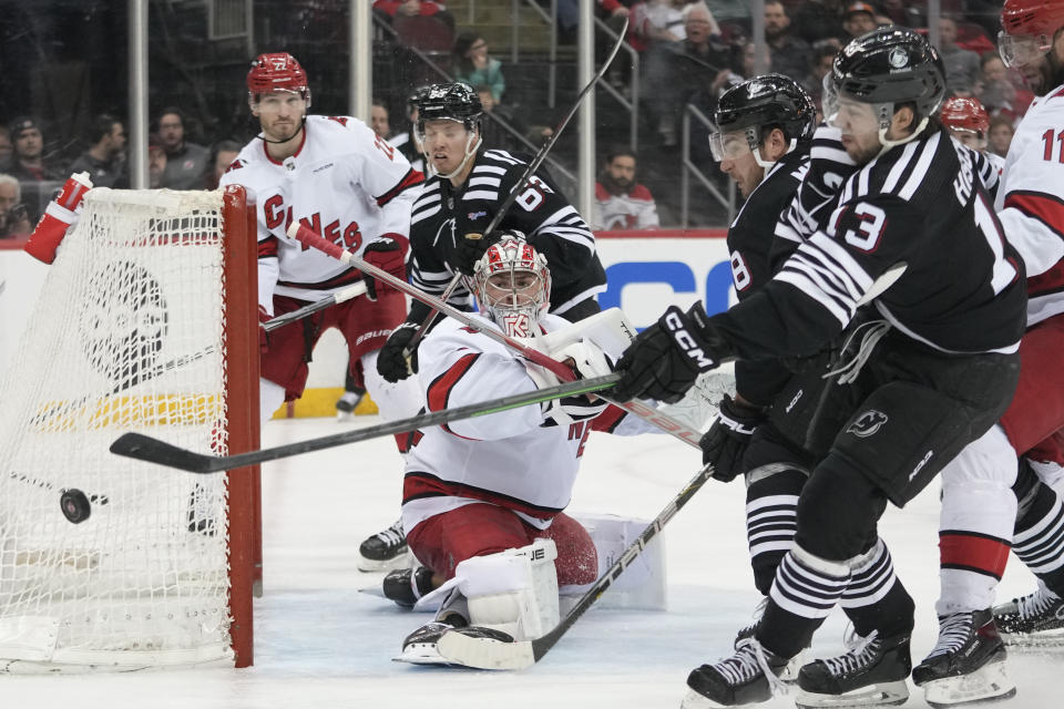 Carolina Hurricanes goaltender Pyotr Kochetkov (52) tends net against the New Jersey Devils during the second period of an NHL hockey game, Saturday, March 9, 2024, in Newark, N.J. (AP Photo/Mary Altaffer)