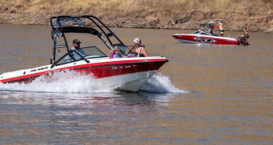 Recreational boaters pass on Lake Kaweah on Friday, June 23, 2023.