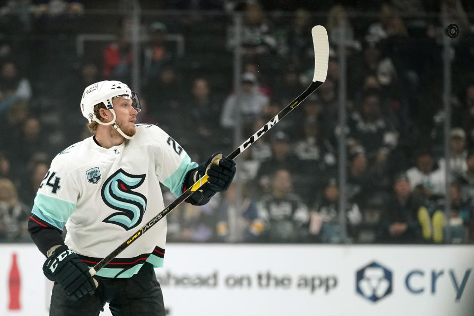 Los Angeles Kings center Phillip Danault tires to knick the puck out of the air during the third period of an NHL hockey game against the Los Angeles Kings Monday, March 28, 2022, in Los Angeles. (AP Photo/Mark J. Terrill)