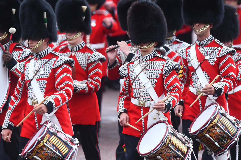 Soldiers march to Horse Guards Parade in London with their rifles in hand, ahead of the Trooping the Colour ceremony.