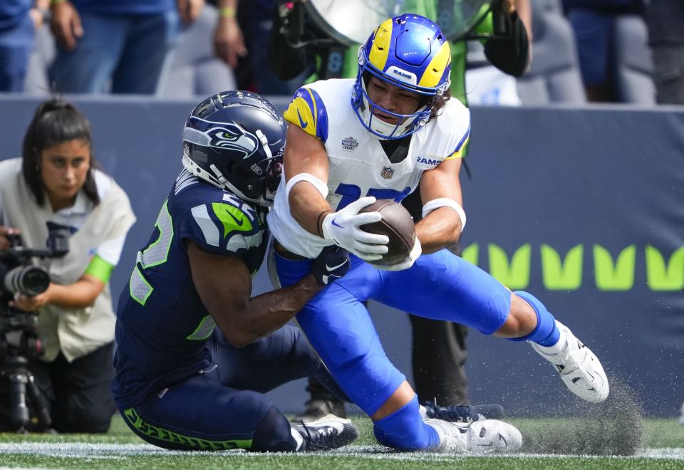 Los Angeles Rams wide receiver Puka Nacua is tackled by Seattle Seahawks cornerback Tre Brown (22) during the first half of an NFL football game, Sunday, Sept. 10, 2023, in Seattle. ( | Lindsey Wasson, Associated Press