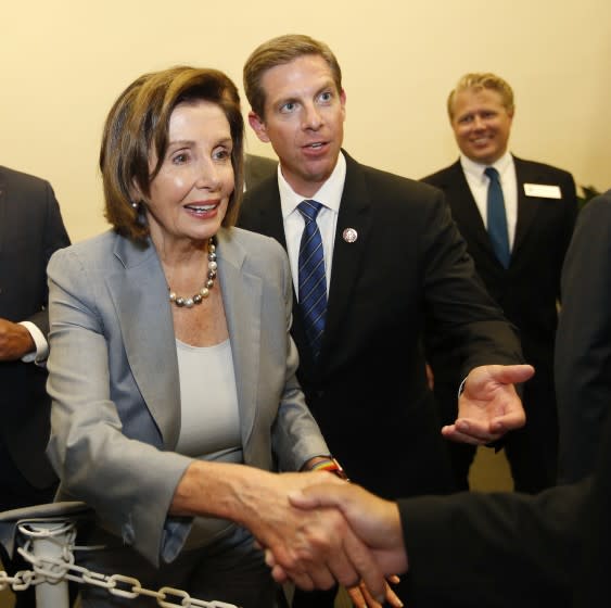 House Speaker Nancy Pelosi greeted supporters after speaking with Rep. Mike Levin, right, at community event in Oceanside on Nov. 4, 2019.