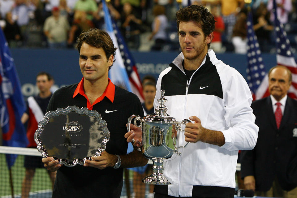 NEW YORK - SEPTEMBER 14:  (L-R) Roger Federer of Switzerland and Juan Martin Del Potro of Argentina pose with their trophies after the Men's Singles final on day fifteen of the 2009 U.S. Open at the USTA Billie Jean King National Tennis Center on September 14, 2009 in the Flushing neighborhood of the Queens borough of New York City. Del Potro defeated Federer 3-6, 7-6 (7), 4-6, 7-6 (7), 6-2.  (Photo by Al Bello/Getty Images)