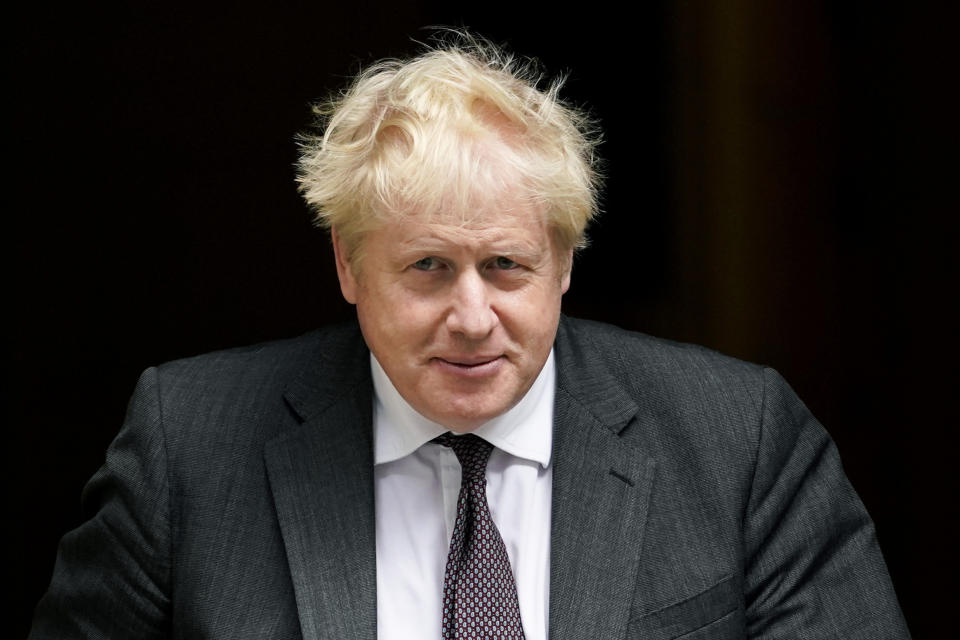 Britain's Prime Minister Boris Johnson leaves 10 Downing Street as he makes his way to Parliament to attend the weekly Prime Minister Questions session, in London, Wednesday, Sept. 15, 2021. (AP Photo/Alberto Pezzali)