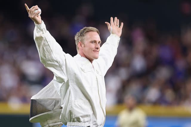 <p>Christian Petersen/Getty</p> Beekeeper Matt Hilton throws out the ceremonial first pitch at the Los Angeles Dodgers vs. Arizona Diamondbacks game on April 30, 2024.