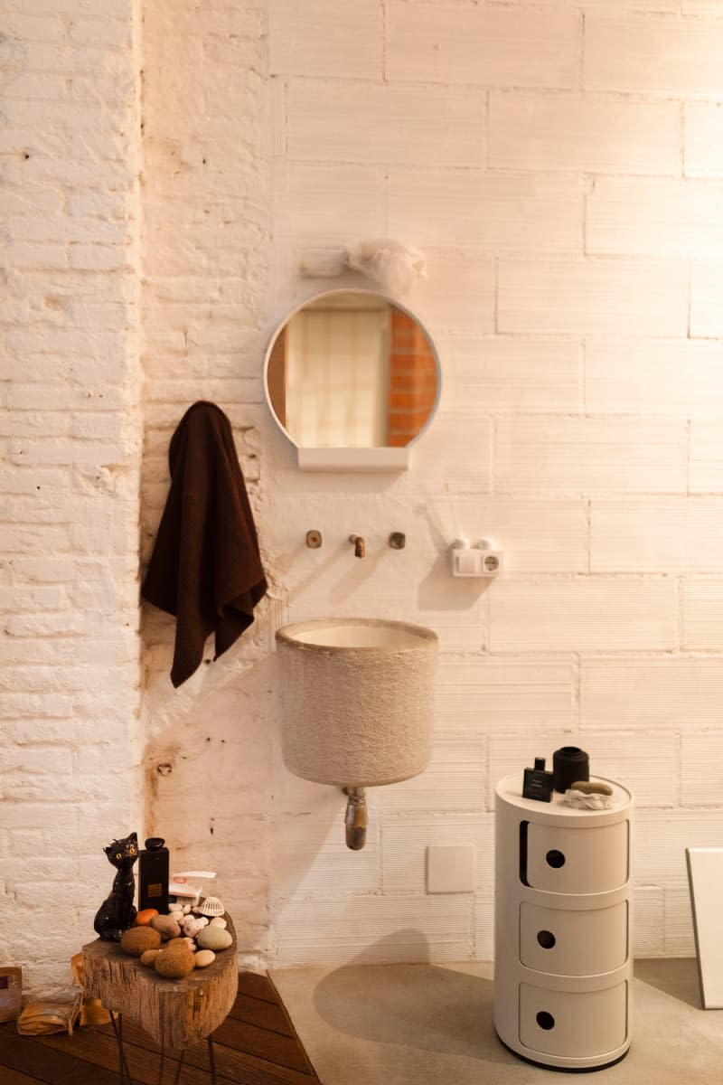 white brick bathroom with lots of round edges