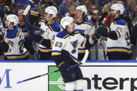 St. Louis Blues left wing Jake Neighbours (63) celebrates his goal during the first period of an NHL hockey game against the Buffalo Sabres, Saturday, Feb. 10, 2024, in Buffalo, N.Y. (AP Photo/Jeffrey T. Barnes)