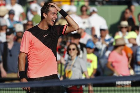 Mar 24, 2018; Key Biscayne, FL, USA; Thanasi Kokkinakis of Australia reacts after his match against Roger Federer of Switzerland (not pictured) on day five of the Miami Open at Tennis Center at Crandon Park. Kokkinakis won 3-6, 6-3, 7-6(4). Mandatory Credit: Geoff Burke-USA TODAY Sports
