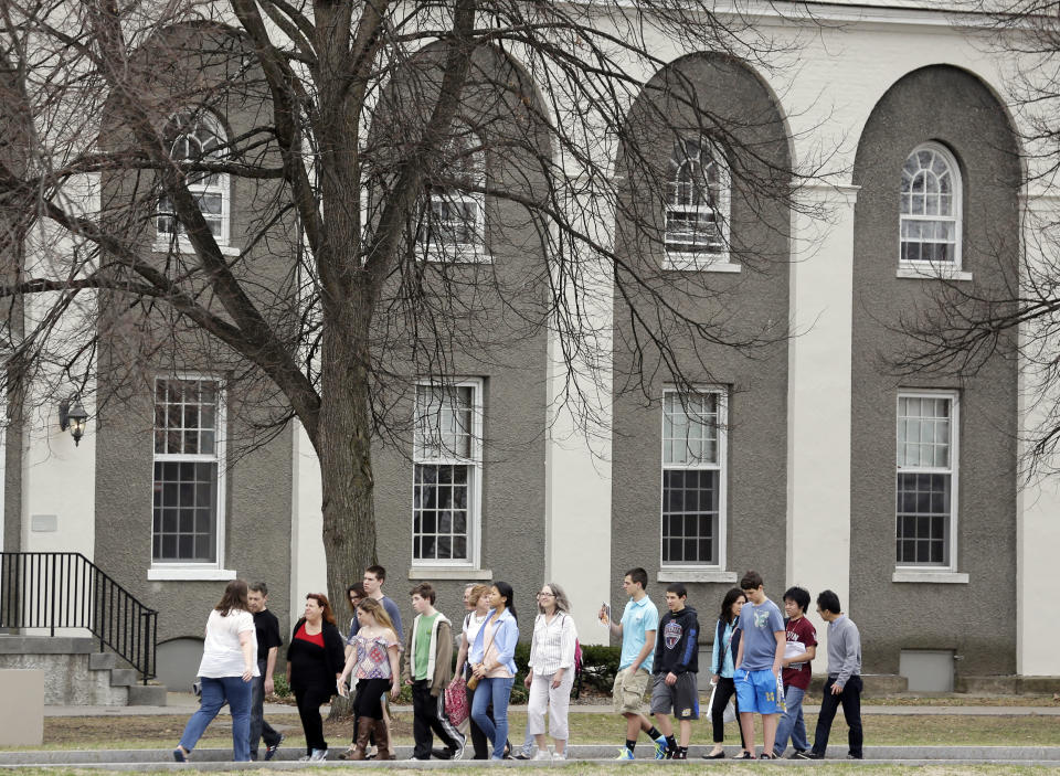 Accepted students and their parents tour Union College on Monday, April 14, 2014, in Schenectady, N.Y. Tiny Union, enrollment 2,200, defeated Minnesota, enrollment 48,000, Saturday for its first NCAA hockey title. (AP Photo/Mike Groll)